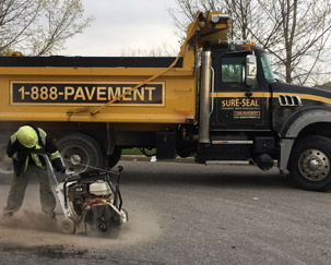 High Speed Saw cutting out pavement