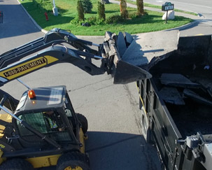 Discarded asphalt is recycled and put into the dump truck